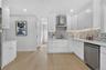 Kitchen featuring white shaker cabinetry, light wood-finish flooring, recessed lighting, and stainless steel appliances