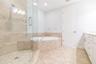 Frameless glass shower, soaker tub - it's all there