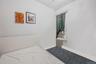 Bedroom featuring radiator heating unit and baseboards