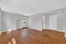 Unit #2-Spacious living area with view into the kitchen and entry.