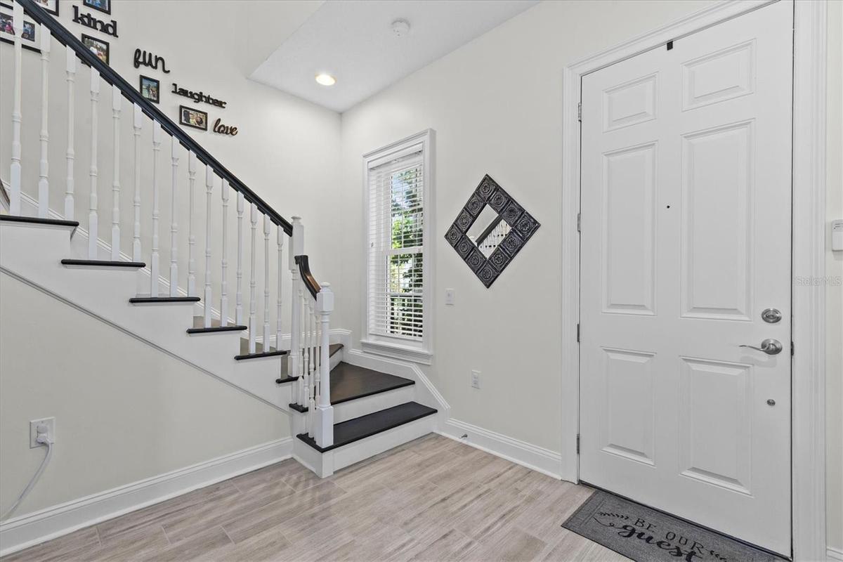Front door opens to spacious foyer.