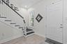 Front door opens to spacious foyer.