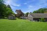 A lush, level expanse of land behind the garage, offering exceptional space, privacy, and future potential.