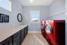 The laundry is upstairs and has plenty of room for all the essentials.