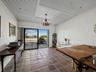 The ground level bonus room with sliders to the pool