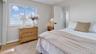 Bedroom featuring wood finished floors and baseboards