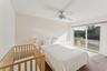 Bedroom with ceiling fan, carpet floors, and access to outside