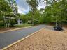View of road featuring view of wooded area