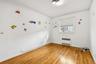 Spare room with light wood-type flooring and radiator heating unit