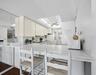 A Galley style kitchen is open through the breakfast bar so you can still see that amazing view....