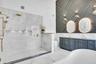 Soaring ceilings and marble shower.