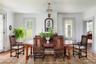 Dining room with wood finished floors and ornamental molding