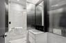 Bathroom with vanity and a shower with shower door
