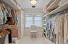 Walk in closet featuring carpet and visible vents