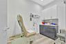 Medical office featuring vanity, light wood-style floors, tasteful backsplash, and recessed lighting