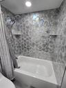 Elegant tile in bathroom 2 shower.
