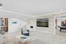 Unfurnished living room featuring recessed lighting, concrete floors, and baseboards