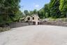 Plenty of parking in driveway as well as on the lower graveled parking area not shown in photo.