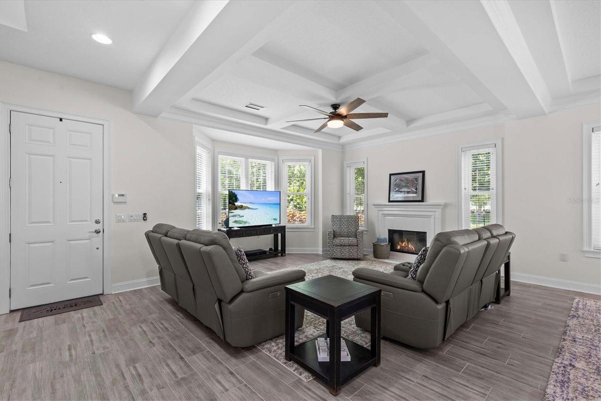 Light fills the room from the bay and side windows. 2023 Hurricane windows throughout the property.