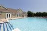 Expansive outdoor swimming pool with integrated stairs and a perimeter deck
