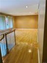 Living room with freshly polyurethaned wood floors