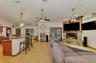 French doors lead to the super-sized screened lanai