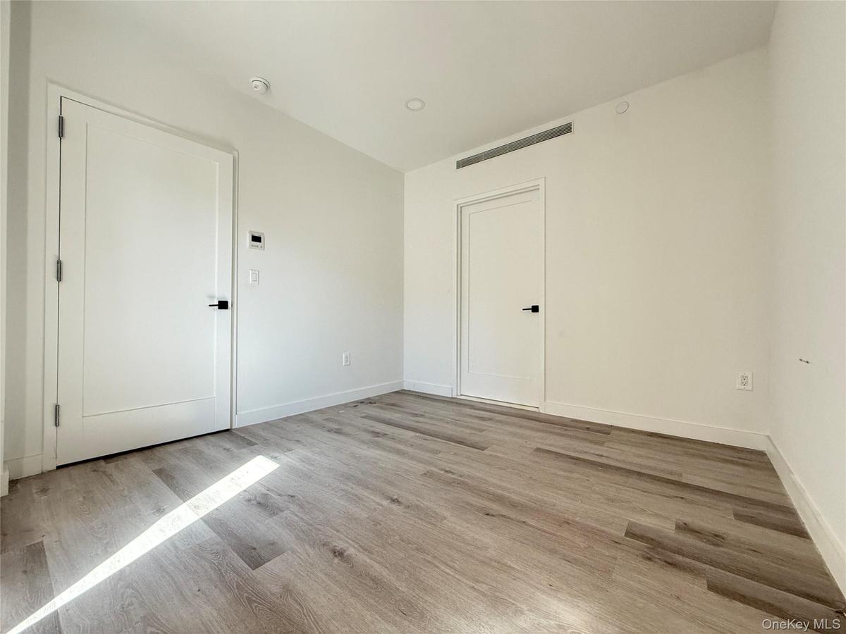 Unfurnished room featuring light wood finished floors and recessed lighting