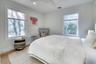 Bedroom with baseboards, visible vents, wood finished floors, and recessed lighting