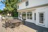 Home has awning that retracts over the deck.