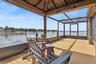 Enclosed screen room on boat dock
