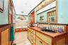 Full bathroom featuring double vanity, a bath, light tile patterned flooring, and recessed lighting
