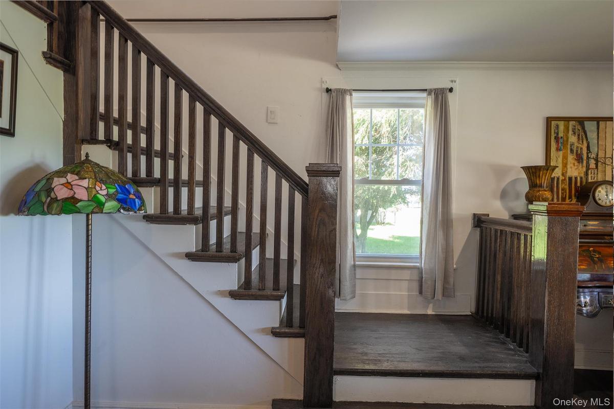 Beautiful front and rear staircases brings the charm and character of this historic Craftsman home together. The back stairs come from the bedrooms to