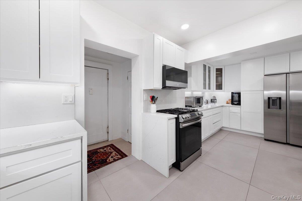 Newly renovated kitchen with Quartzite Counter Tops, New appliances and Cabinets