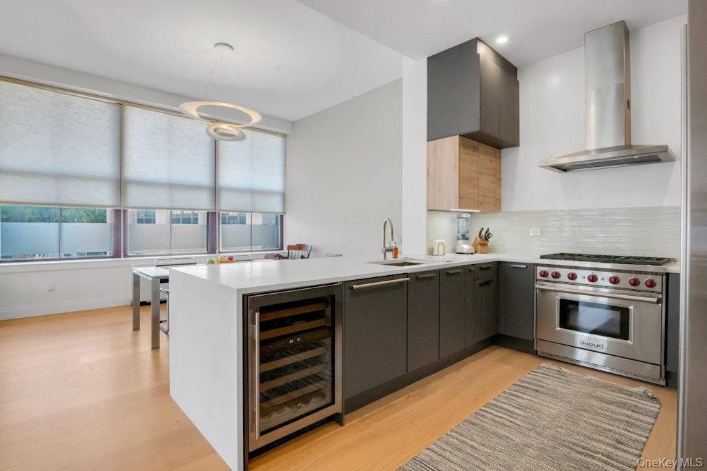 Renovated and expanded kitchen includes 6-burner Wolf range and Subzero Wine Fridge