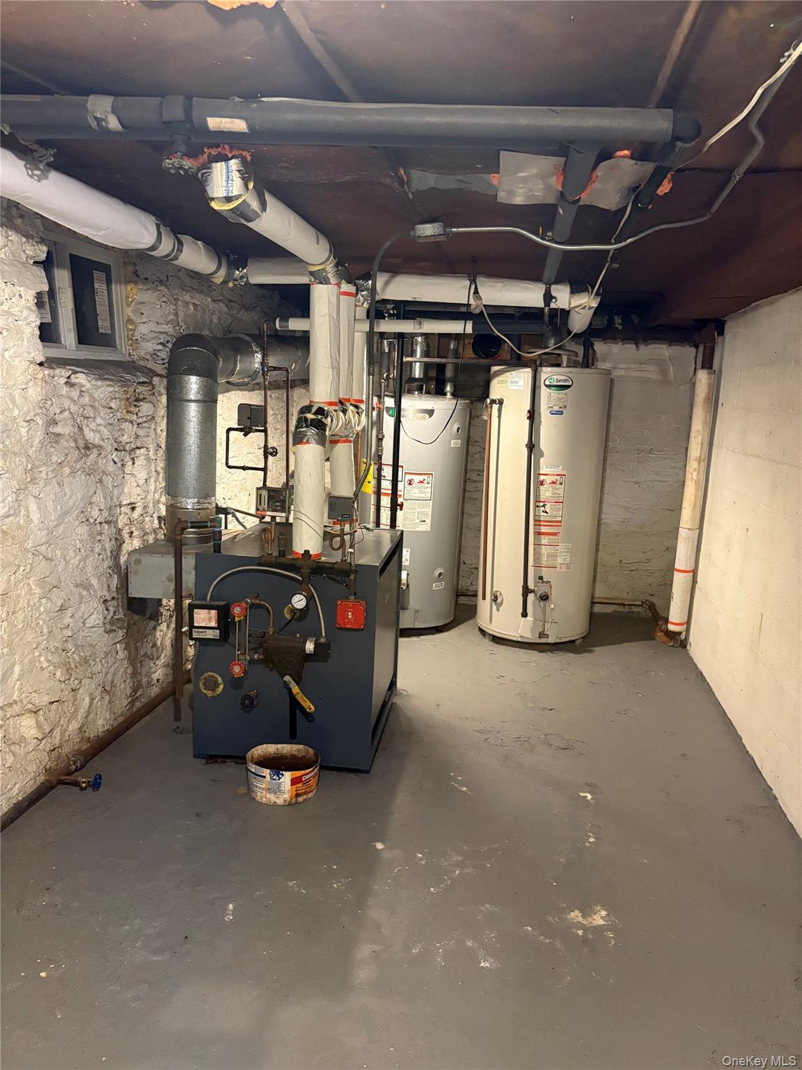 Utilities featuring gas water heater and water heater