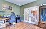 Office with wood flooring and french doors