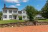 The stunning equine compound is presided over by a circa 1860 main estate masterfully renovated boasting 3,942 SF, 4 bedroom, 5 bathrooms, 11 rooms ov