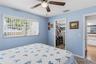 Guest bedroom #2 with walk-in closet and access to guest bath via small hall with linen closet