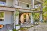 Garden level deck with water view, sauna, outdoor shower, lounging area