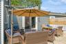 View of patio with an outdoor hangout area