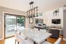 Dining area featuring light wood-type flooring and a wall unit AC