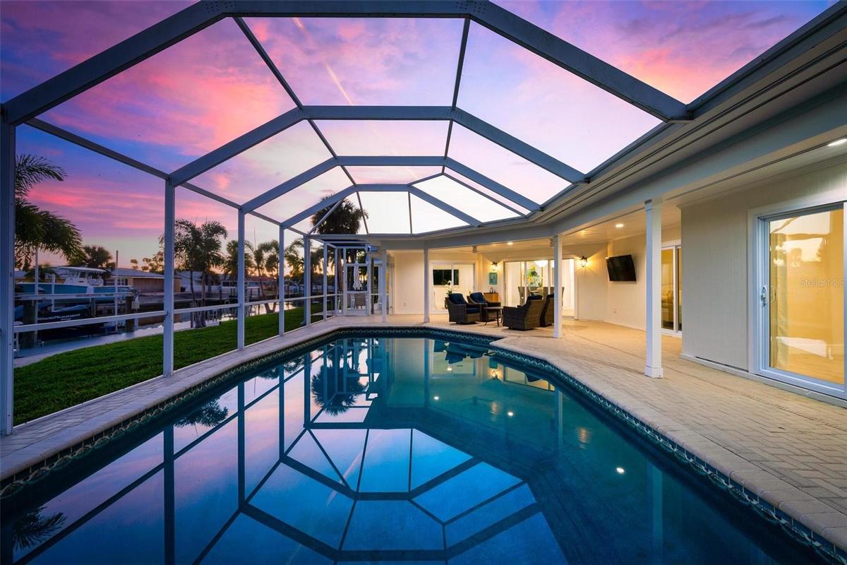 The living room and two of the bedrooms open out onto the pool deck.