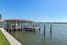 Seawall New in 2026. Private Dock w/ 20,000 covered boat lift, jet ski lift and 10x18 deck over the water