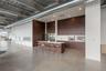 Kitchen with a kitchen breakfast bar, a large island, a high ceiling, modern cabinets, and open floor plan