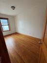 Spare room with light wood-style flooring and baseboards