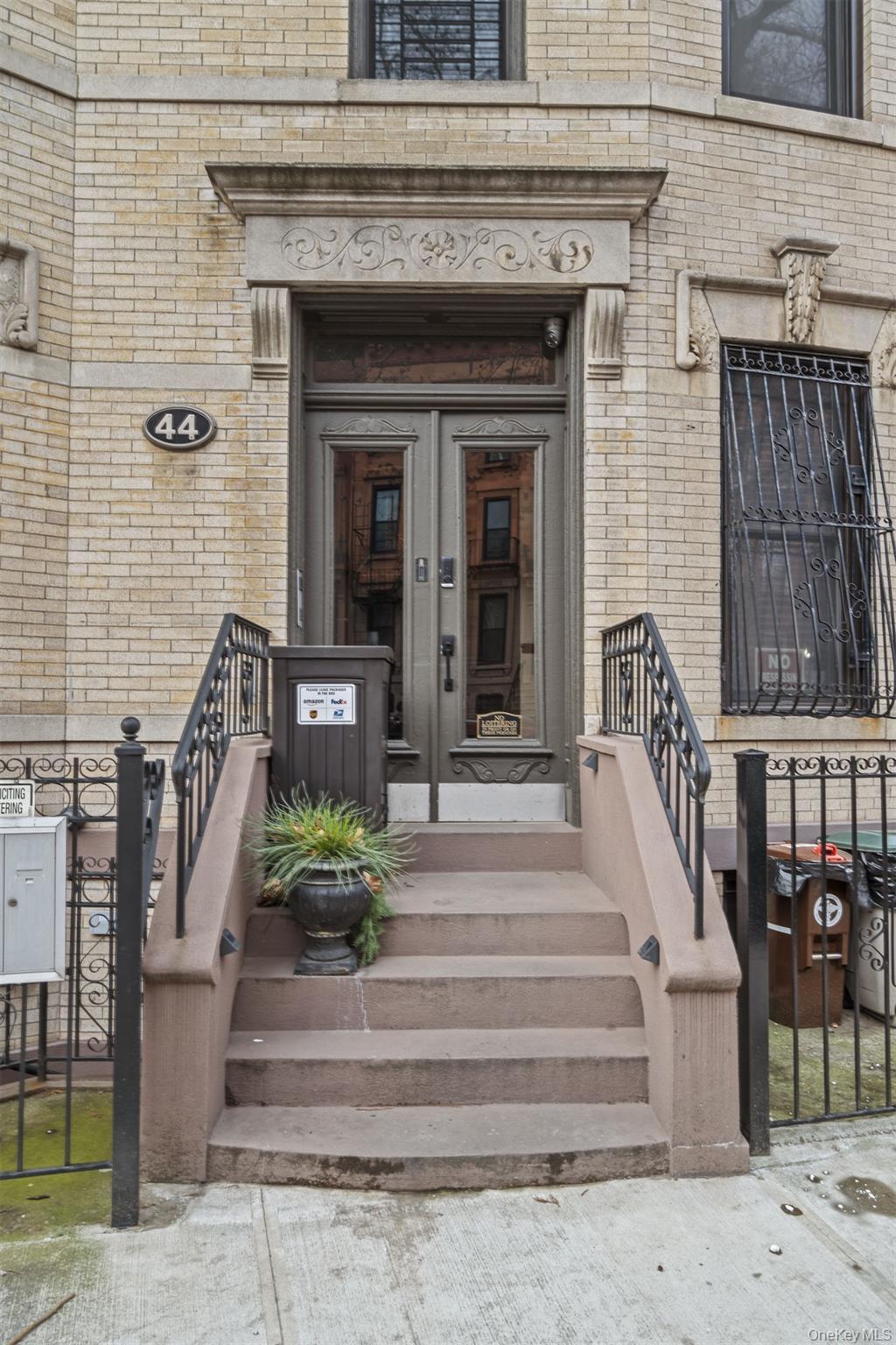 Doorway to property with brick siding