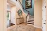Foyer virtually staged with decor.