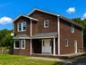 Two-story residence featuring cedar shake siding, a bay window, and a covered entry porch ( Ai enhanced)