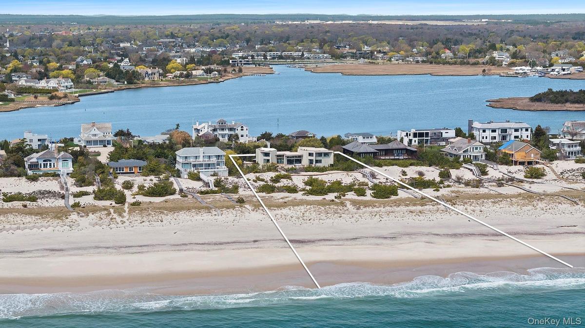 Bird's eye view featuring a water view and a view of the beach