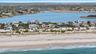 Bird's eye view featuring a water view and a view of the beach